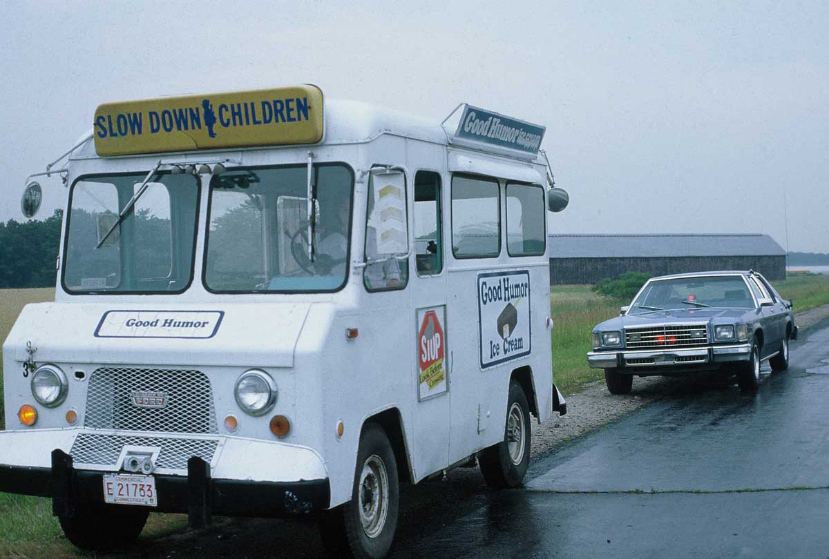 Connecticut police car puuling over ice cream truck