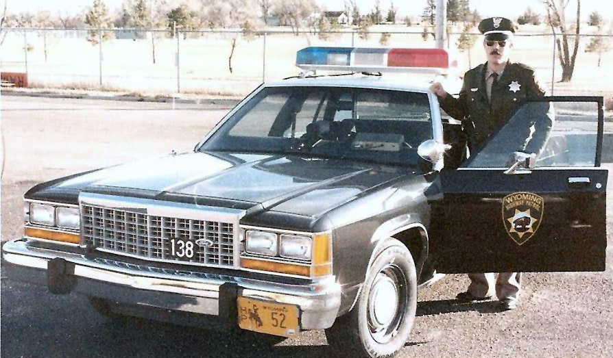 Wyoming police officer and car