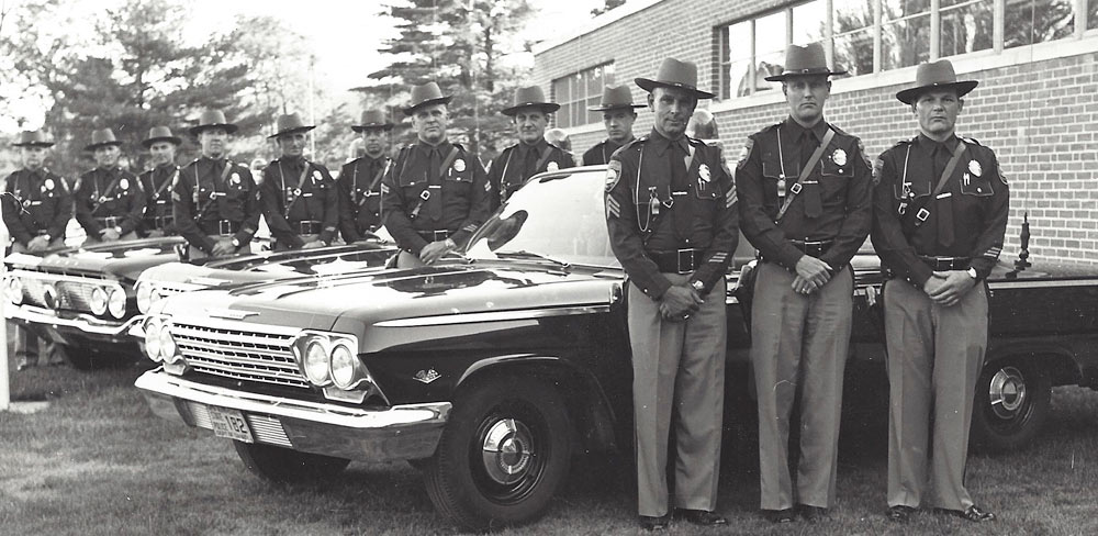 New Hampshire police officers and car