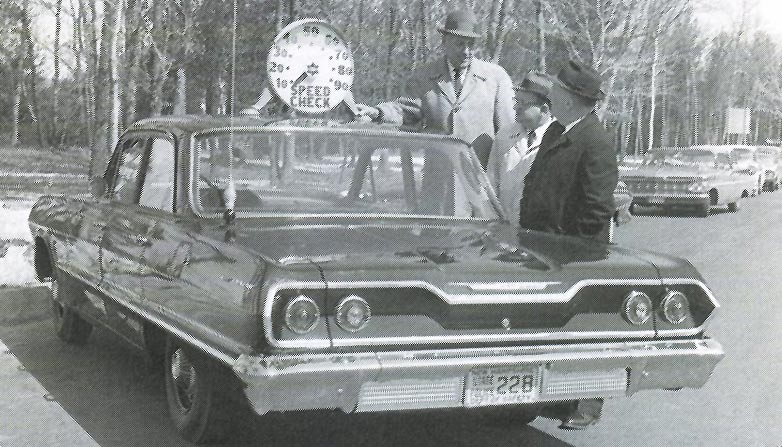 New Hampshire police officers and car