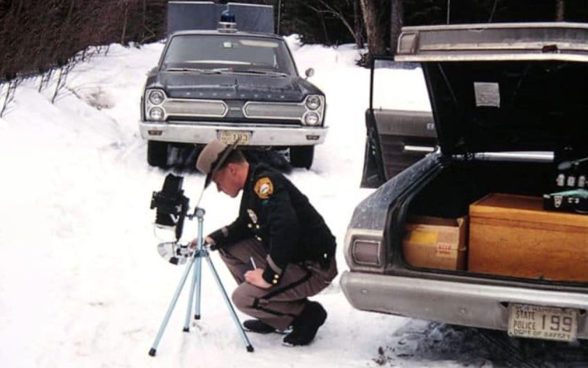 New Hampshire police officers and car