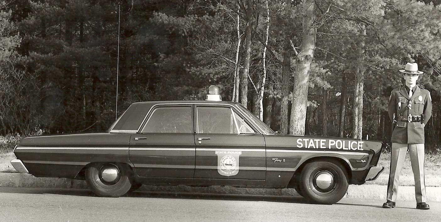 New Hampshire police officers and car